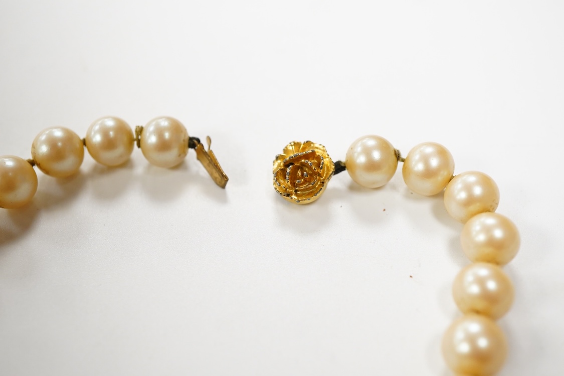 Two single strand graduated cultured pearl necklaces, one with a single stone rose cut diamond set 9ct white metal clasp, 42cm, together with a simulated pearl necklace and three assorted costume brooches.